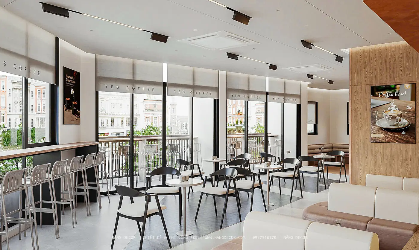 Cầu thang xoắn ốc bằng thép trở thành điểm nhấn trong thiết kế nội thất quán cafe 2 tầng.